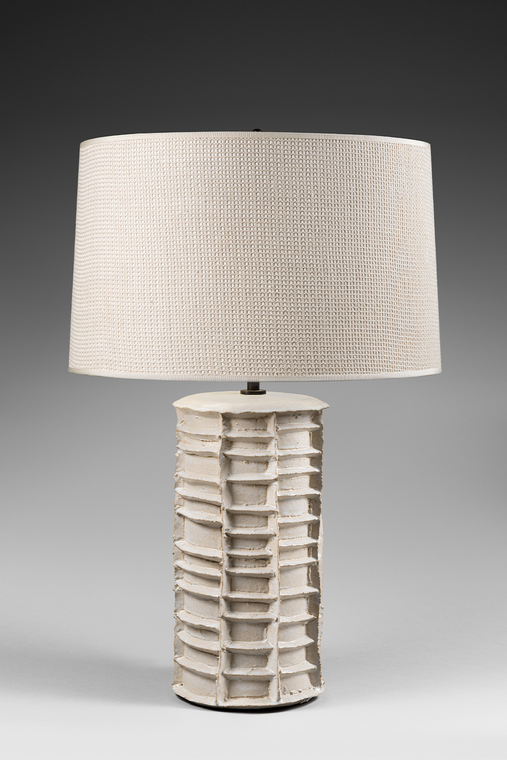 White cylindrical table lamp